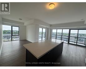 A spacious room with a large table and a view of the city.