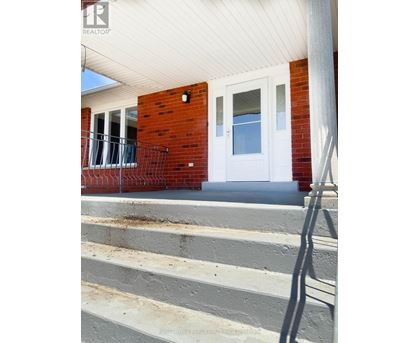A house with a white door and a porch.