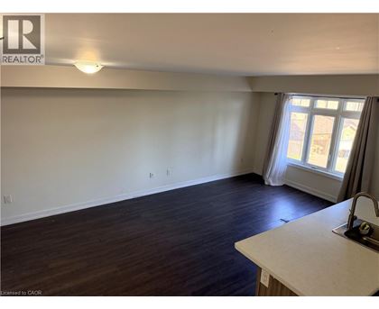 A room with a window and a sink.