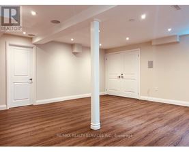 A room with a white door and a white closet door.