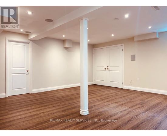 A room with a white door and a white closet door.