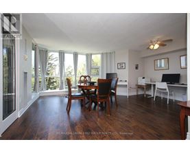 A dining room with a table and chairs is shown.