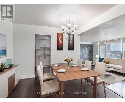 A dining room with a wooden table set for six.