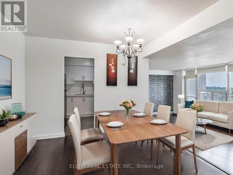 A dining room with a wooden table set for six.