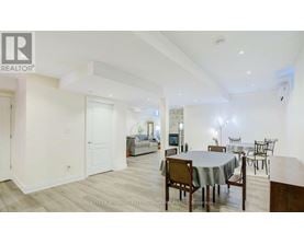 A dining room with a table set for six.