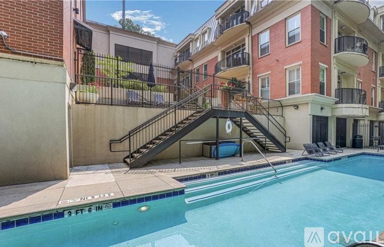 A pool with a slide in the middle of it.