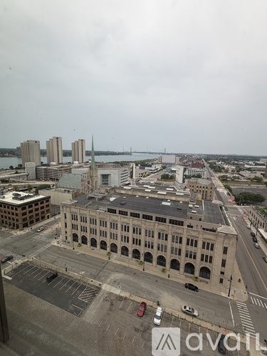 A large building with a parking lot in front of it.