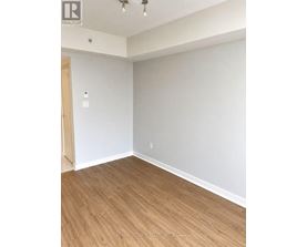 A room with a wooden floor and white walls.