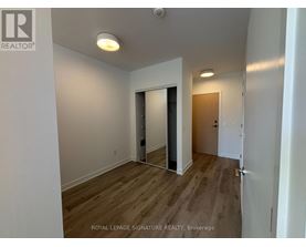 A room with a doorway leading to another room.