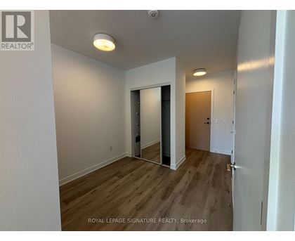 A room with a doorway leading to another room.