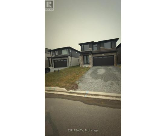 A house with a grey garage door is shown in the image.