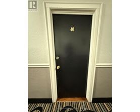 A black door with the number 40 on it.