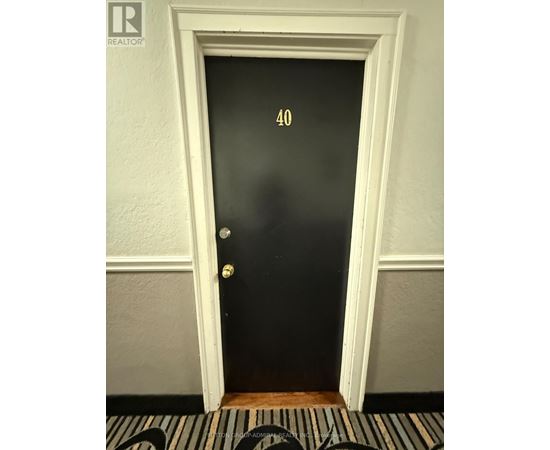 A black door with the number 40 on it.