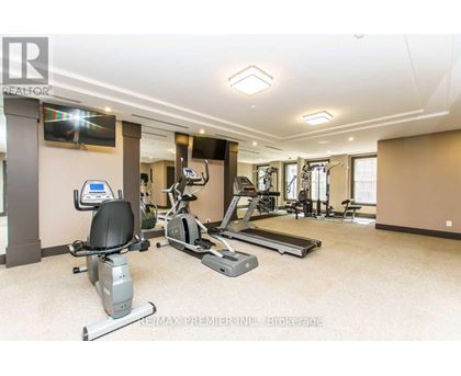 A spacious home gym with a variety of exercise equipment.