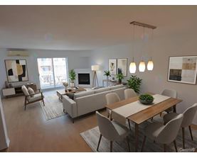 A modern living room with a dining table and chairs.