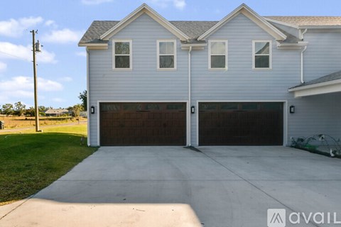 A two-car garage is attached to a house.