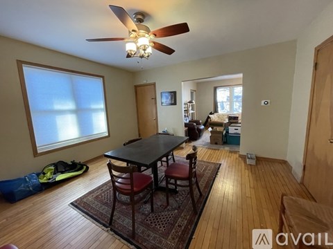 A room with a table and chairs in it.