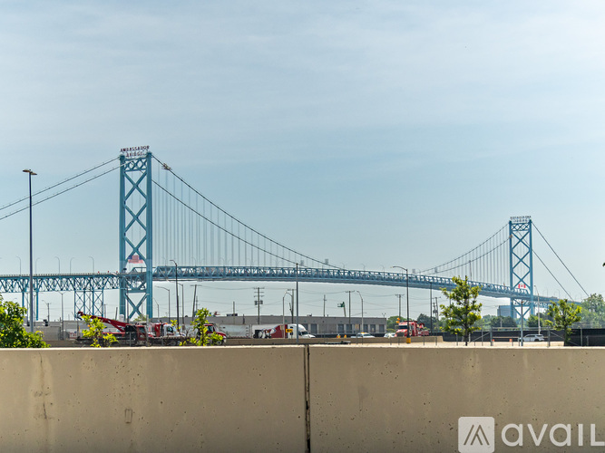 A large blue bridge spans the distance in the background.