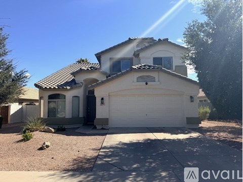 A house with a garage is for sale.