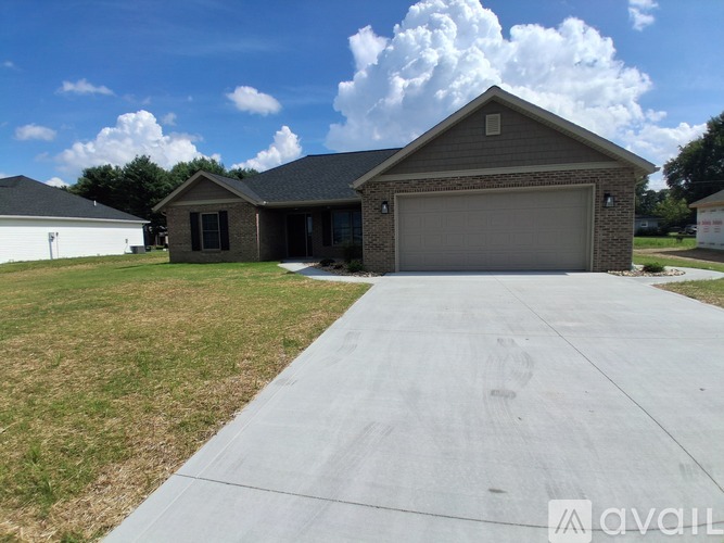 A house with a garage is available for sale.