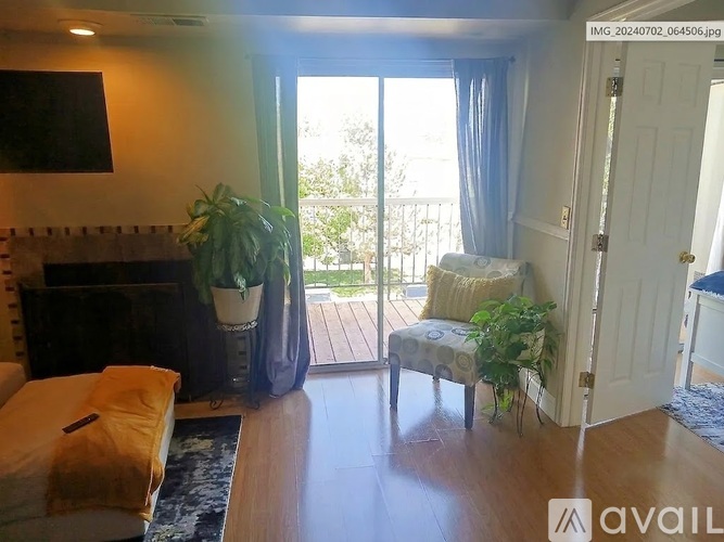 A living room with a fireplace and a chair.