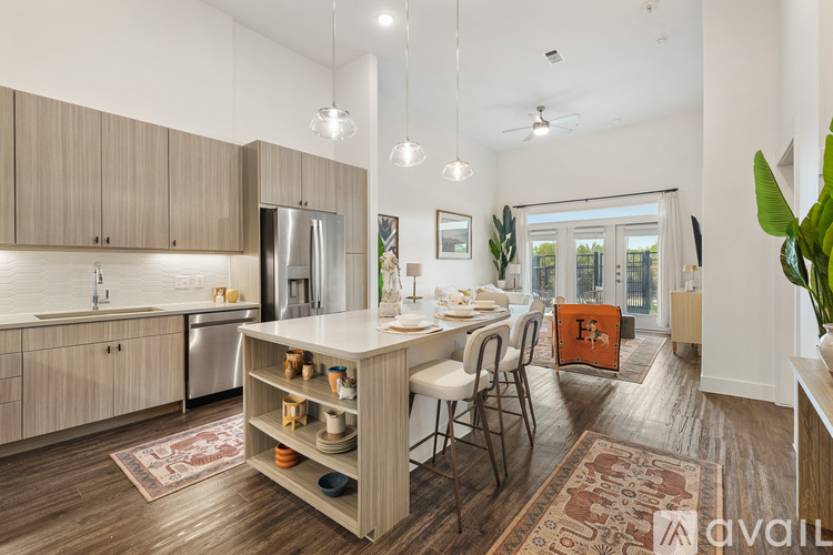 A kitchen with a table and chairs in the middle of the room.