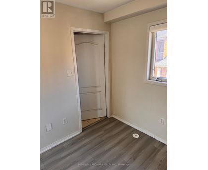 A room with a door and a window.