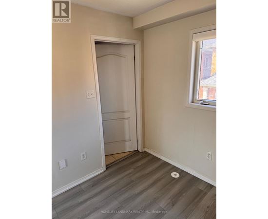A room with a door and a window.