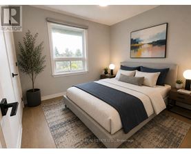 A bedroom with a large bed and a painting on the wall.