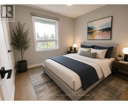 A bedroom with a large bed and a painting on the wall.