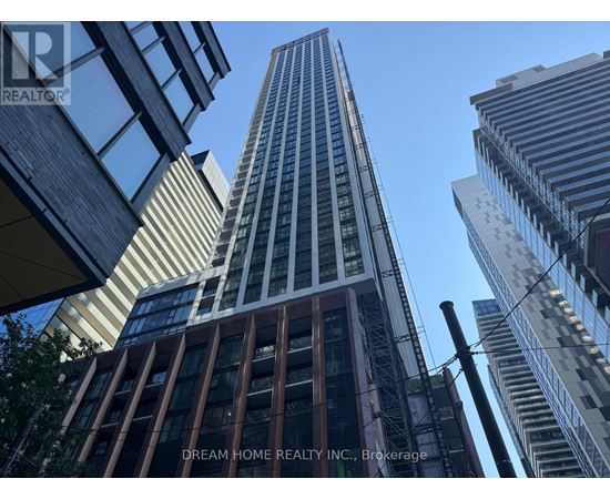 A tall building with the words "Dream Home Realty Inc., Brokerage" on the side.