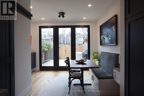 A dining area with a table and chairs is shown in the image.