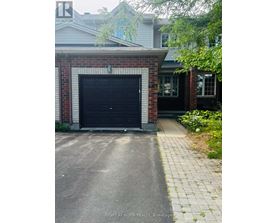 A black garage door is closed.