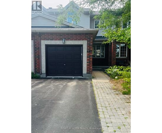A black garage door is closed.