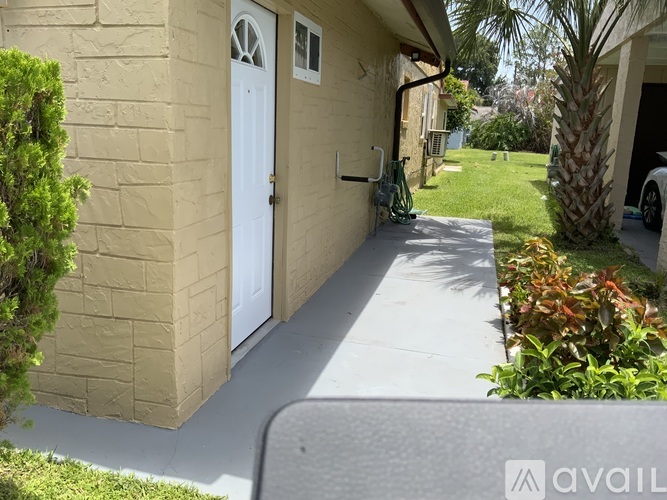 A house with a white door and a white wall.