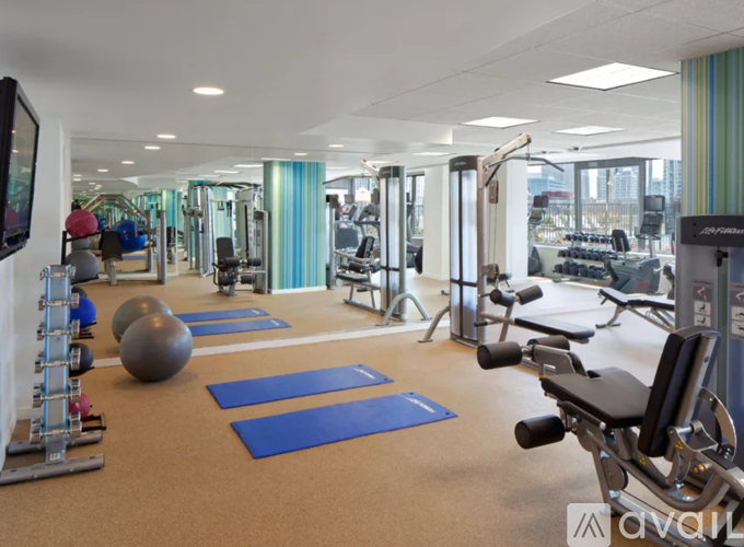 A well-equipped gym with various exercise machines and equipment.