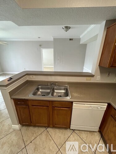 A kitchen with a sink and a dishwasher.