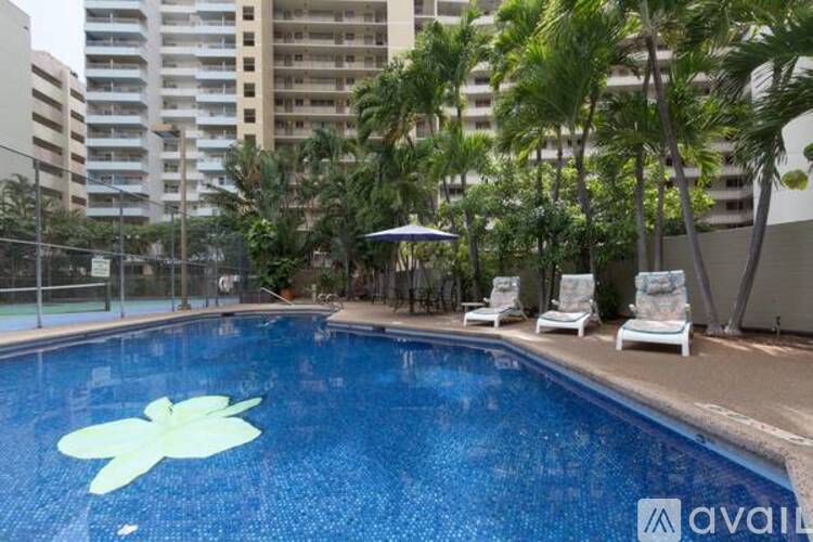 A pool with a flower design in the middle of it.
