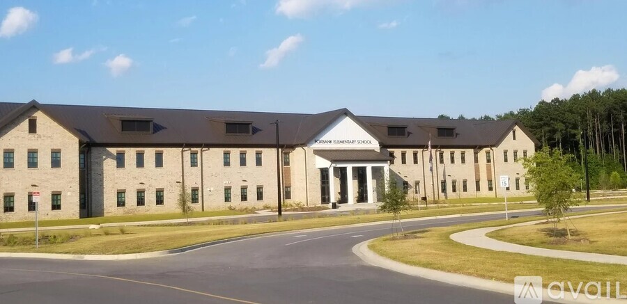 A large building with a sign that says "AVAILABLE" in front of it.