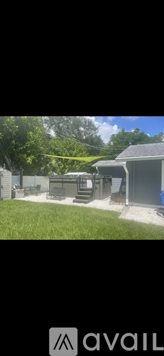 A house with a backyard and a tree.