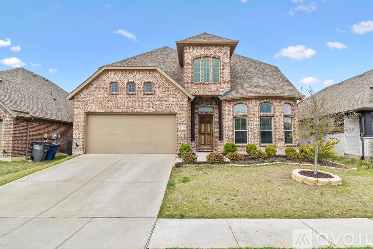 A house with a brown brick exterior and a large front yard.