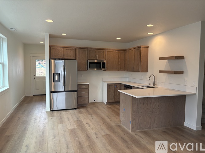 A kitchen with wooden cabinets and a white countertop.