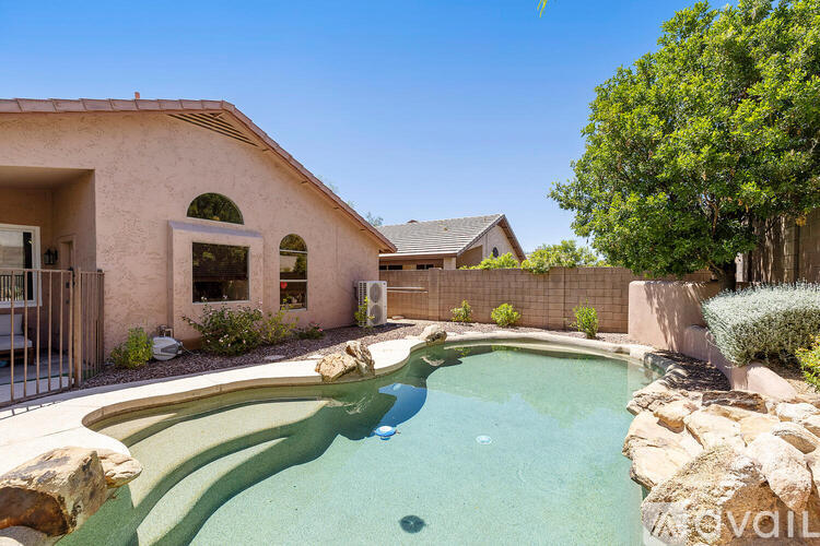 A house with a pool in the backyard.
