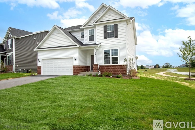 A house with a white garage door is for sale.