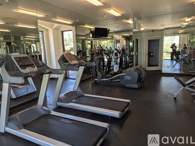 A gym with treadmills and exercise equipment.