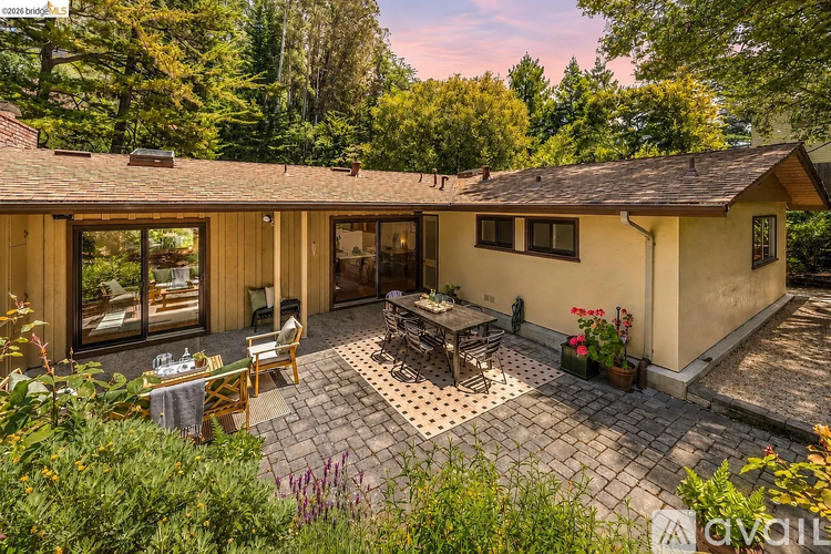 A house with a patio and a table set for dining.