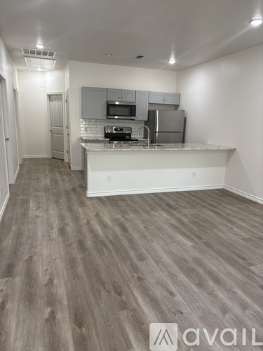 A kitchen with a countertop and cabinets.