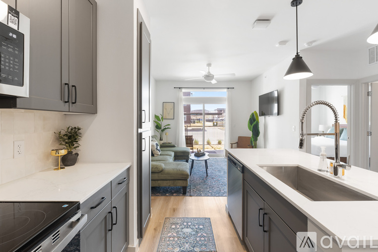 A modern kitchen with a view of the backyard.