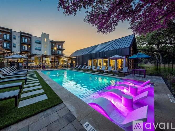 A pool with a purple light in the middle of it.