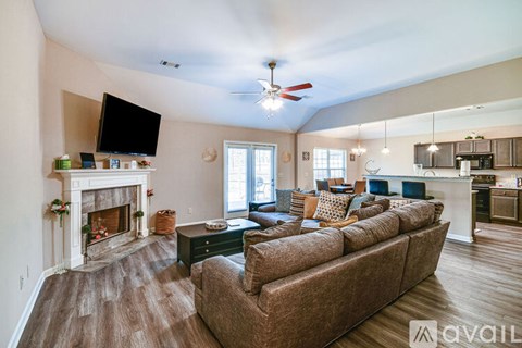 A living room with a fireplace and a couch.